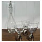 Glass decanter with neat silver stem glasses