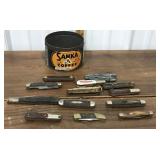 Assorted pocket knives, Sanka coffee tin