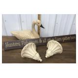 Decorative goose, wall sconces, sign