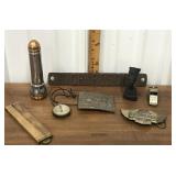 Flashlight, belt buckles, compass, whistle,