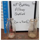 2 NY milk bottles - Albany & Sheffield - barn
