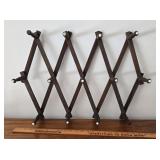 Folding hat rack w/white porcelain buttons