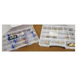 Pins / brooches in 2 plastic containers