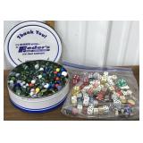 Tin full of marbles & assorted dice