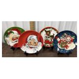 4 Mr. Christmas decorative plates with stands