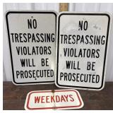 2 road signs No Trespassing signs and Weekdays