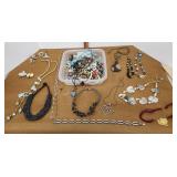 Plastic tub of costume jewelry