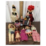 Bin of vintage foreign dolls