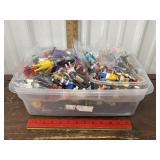 Bin of Lego people and Playmobil people