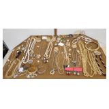 Costume jewelry necklaces, bracelets, brooches,