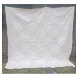 White quilt with vines and lace squares aprx
