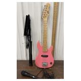 BC electric mini guitar, music stand and plug in