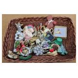Basket of costume brooches