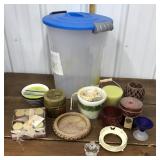 Candles, candle holders in a plastic container