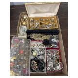 Box lot costume jewelry- pins, bracelets, clip