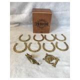 Brass horseshoes, coat hook, key rack in a cigar