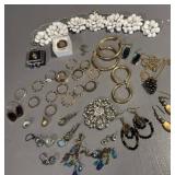 Lot of rings, pins, earrings, necklace, and more.
