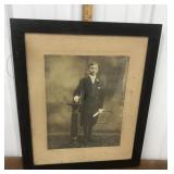 Nicely framed photograph- young man w/ scroll
