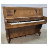Everett oak piano $ donated to candor food pantry