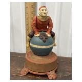 Cast iron bank Clown on globe coin bank