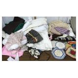 Bag of assorted tablecloths, fabric, pot