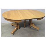 Split pedestal round oak table 2 leaves 65"44"30"