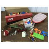 Bottom of toy box- Little junque - some legos