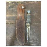 Kabar knife with leather worked sheath