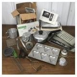 Cake pans, meat grinder, cheese graters, waffle