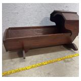 Early wooden hooded cradle