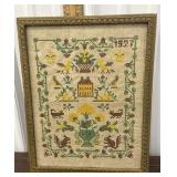 Cross stitched needlepoint sampler