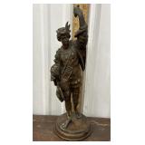 spelter statue known as "The Falconer,"