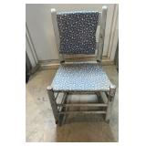 Small porch rocker. Sturdy, just needs a plant