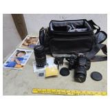 Cannon eos rebel camera with extra lens and bag