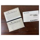 2 older car manuals.  1 1999 Camry, 1 1995 Ram