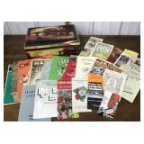 1113Tin full of assorted ephemera- sheet music,