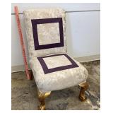upholstered chair in angels motif fabric