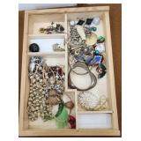 Costume jewelry necklaces etc in display case