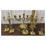 Brass candelabra, wall sconces, and candleholders