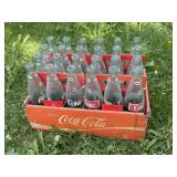 Coca Cola bottles in cartons and tray