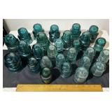 Over two dozen insulators. Small and medium size.