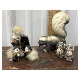 2 Skunk and babies sets *1 has chipped ear