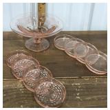 Pink depression glass pedestal dish, coasters