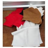 Clear tub of felt fabric pieces