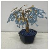 Vintage bonsai tree with gold-colored wire
