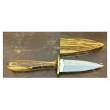 Two sided knife w/ hand carved handle and sheath.