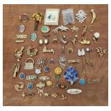 Brooches pins stick pins etc