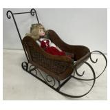 Iron / wicker sleigh w/doll