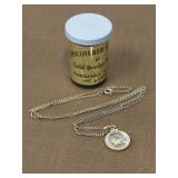 Gold tone necklace containing gold flecks