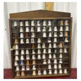 Thimble collection in wooden display